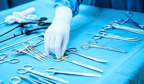 A person is holding a pair of scissors — MedSurg Weight Loss in Brisbane, QLD