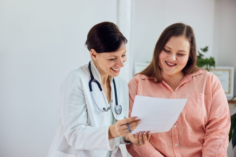 Doctor and patient smiling — MedSurg Weight Loss in Brisbane, QLD