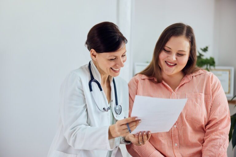 Doctor and patient smiling — MedSurg Weight Loss in Brisbane, QLD