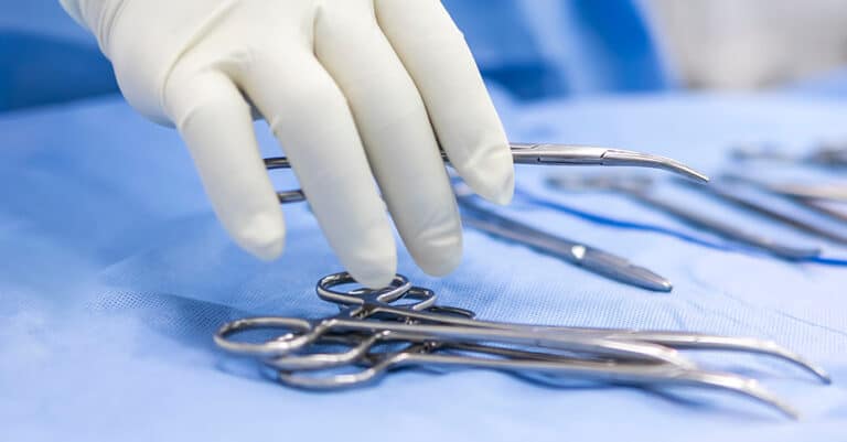 Doctor getting a medical scissor — MedSurg Weight Loss in Brisbane, QLD