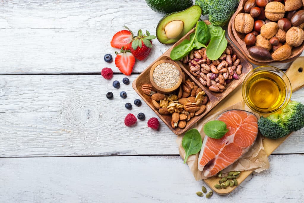 Mediterranean diet foods – fresh vegetables, olive oil, fish and wholegrains