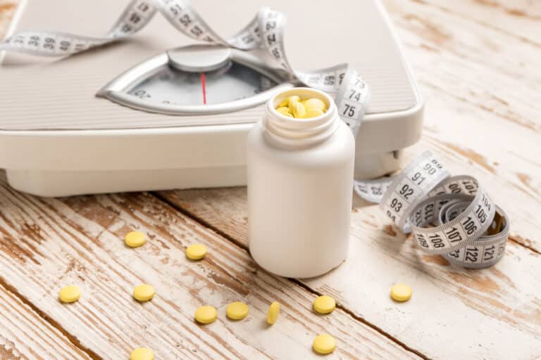 Bottle of Vitamins with a Weight Scale and Measuring Tape — MedSurg Weight Loss in Gold Coast, QLD