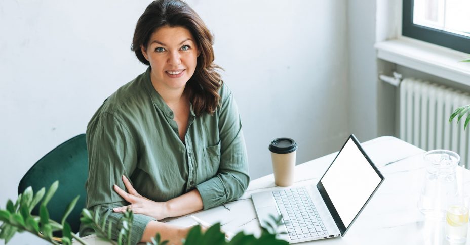 Woman wearing green smiling — MedSurg Weight Loss in Brisbane, QLD