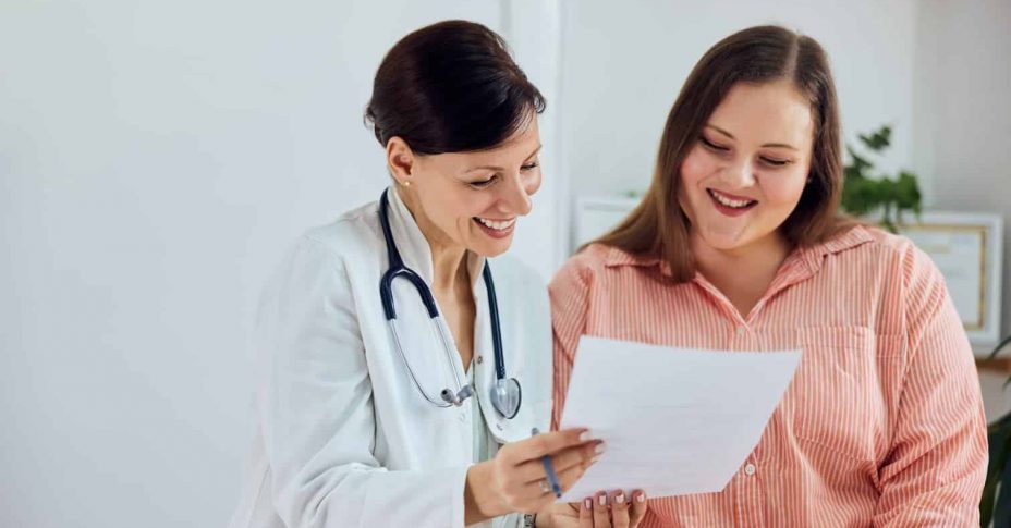 Doctor and patient smiling — MedSurg Weight Loss in Brisbane, QLD